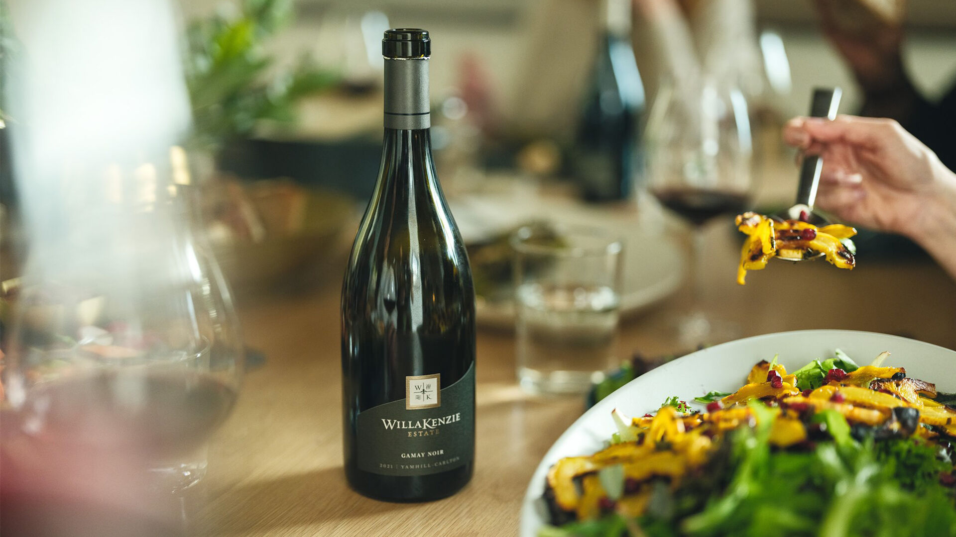 Bottle of gamay noir on table during a dinner.